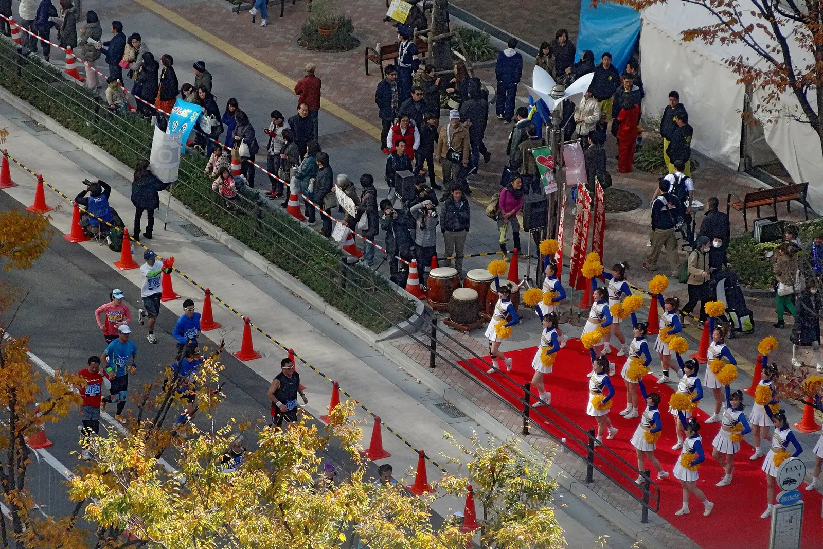 Runners and cheerleaders along the Kobe Marathon course in Kobe city in 2012