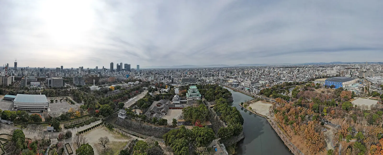 Aerial panorama of Nagoya Castle and the city skyline beyond the moat