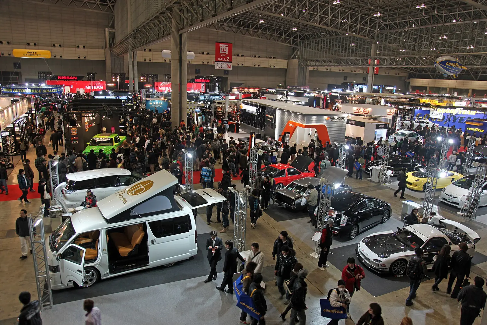 Crowded exhibition hall of modified cars and vans at Tokyo Auto Salon